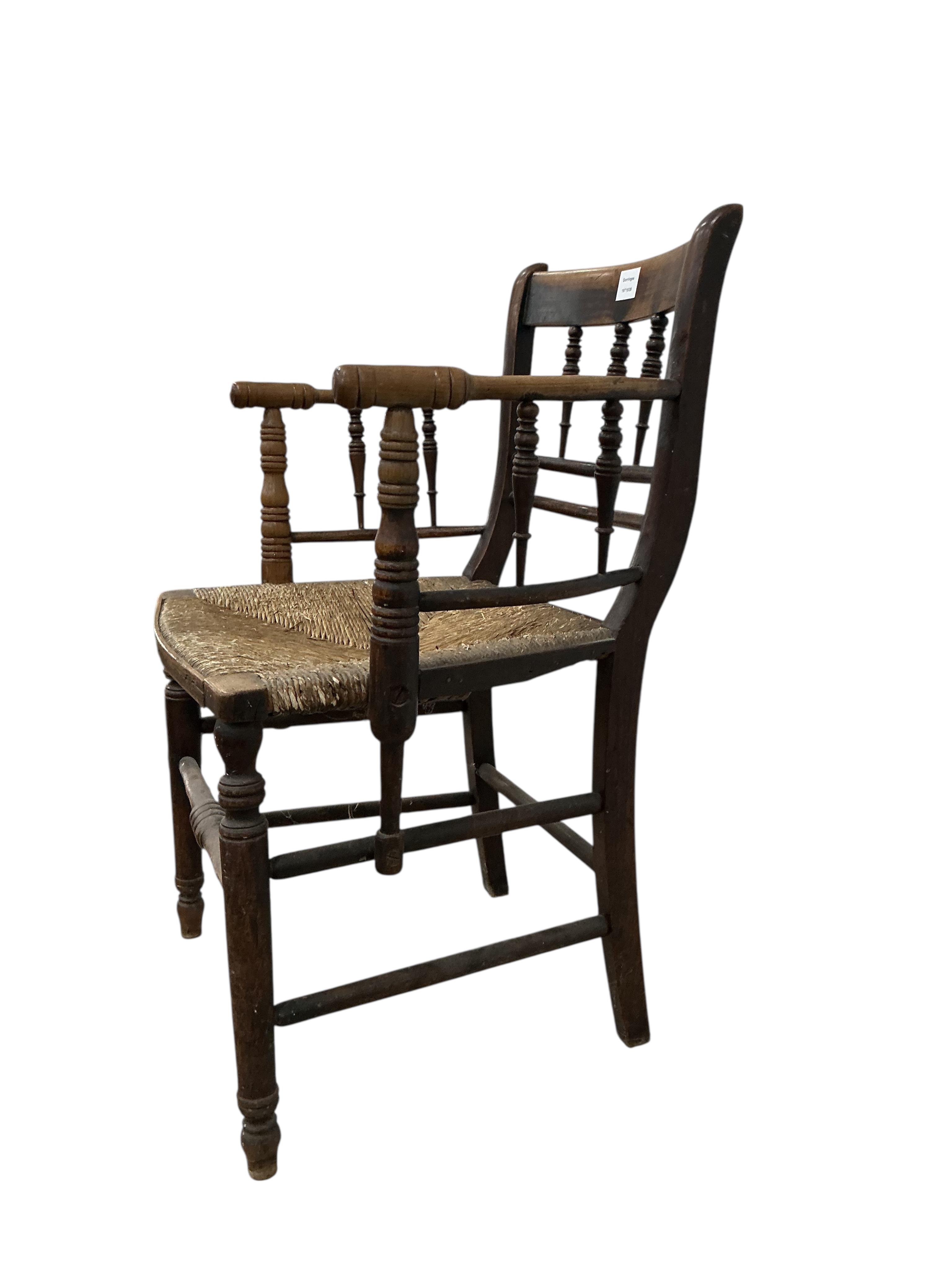 A Victorian Sussex style fruitwood rush seated elbow chair, width 53cm, depth 43cm, height 85cm
